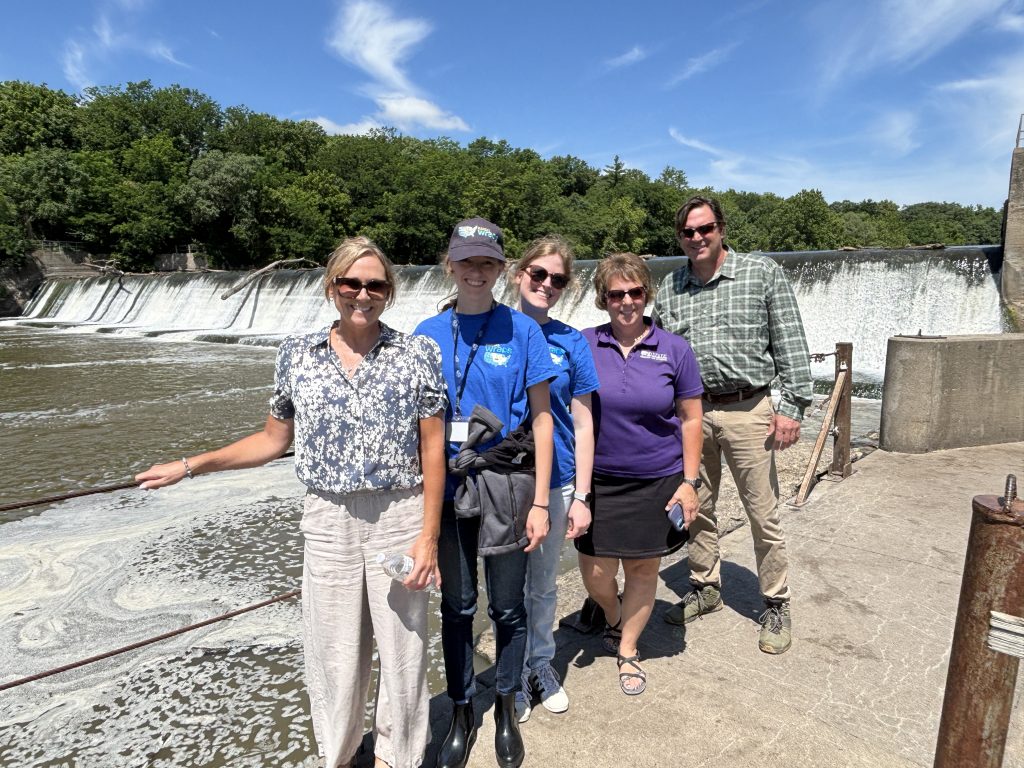 WRAPS partners standing near a Kansas water-control structure during a watershed site visit